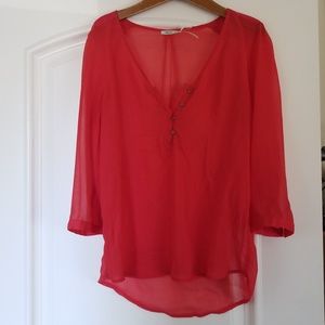 Coral colored sheer blouse
